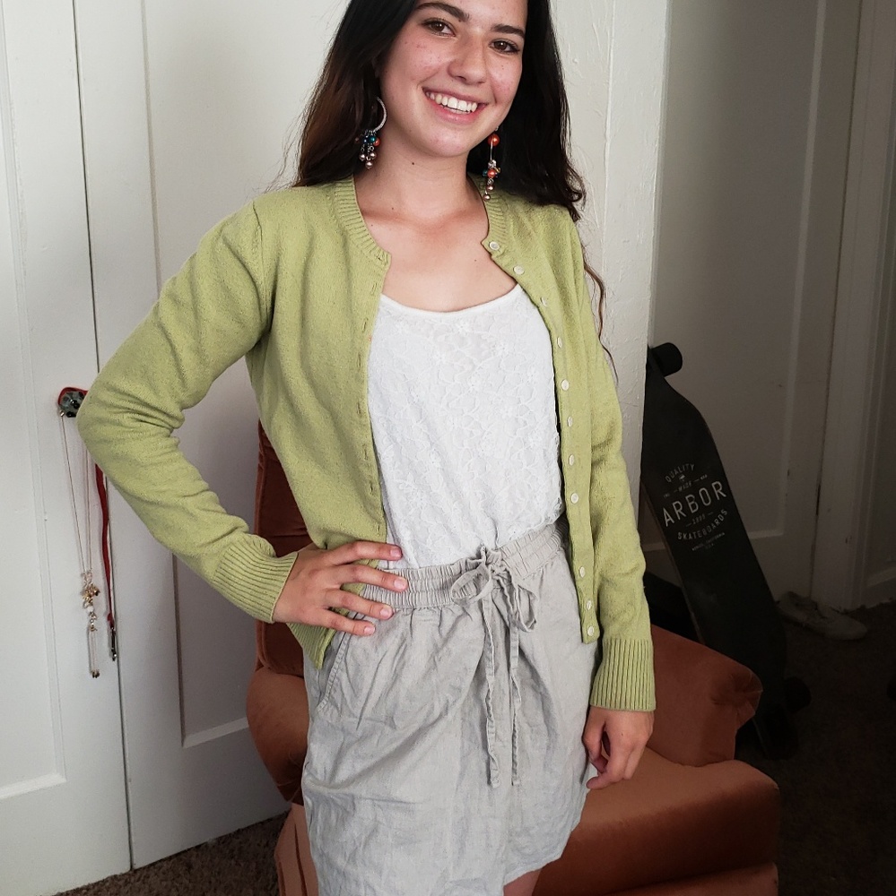 Green sweater/ White tank /Tan skirt
